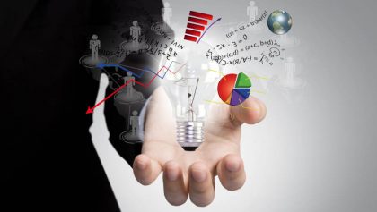 Light bulb in hand with graph out